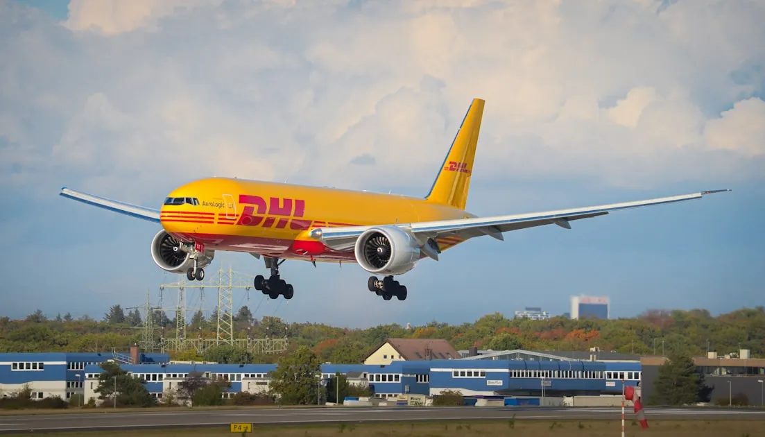 A dhl cargo plane lands on a runway — Tra Cứu Vận Đơn Viettel Post - Kiểm Tra Đơn Hàng Nhanh