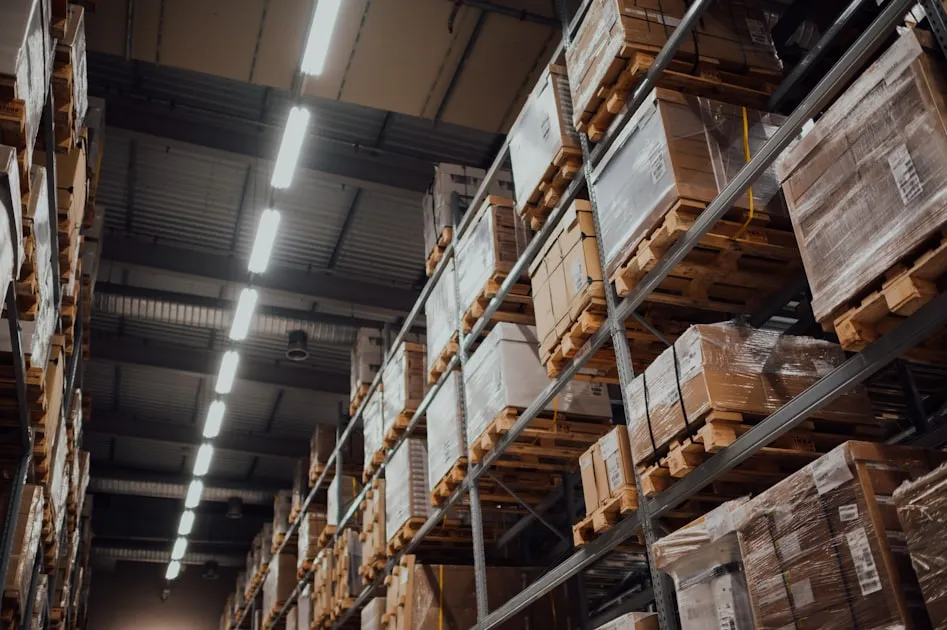brown cardboard boxes on white metal rack — Hàng Cấm Gửi Viettel Post - Những Gì Không Được Gửi?